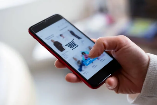 A customer browsing an online shop on a phone